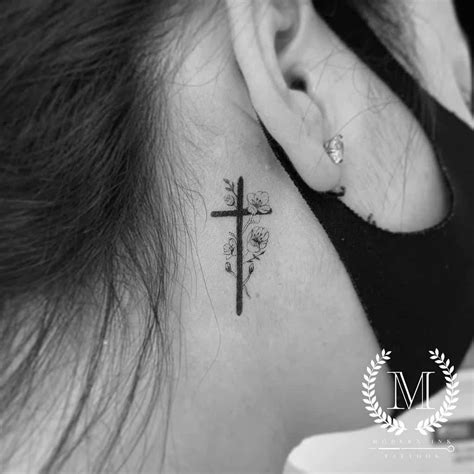 dainty floral cross tattoo|cross behind ear tattoo female.